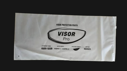 A white plastic visor protection pouch with black printed branding and text, laid flat on a gray concrete floor.